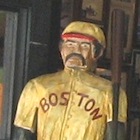 Photo of Red Sox player wooden statue in McGreevys 3rd Base Saloon near Fenway Park in Boston / Boston Sports Tickets - www.boston-discovery-guide.com