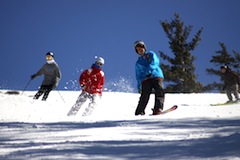 Snowboarders at Attitash, one of the top New England ski areas located in Bartlett, NH Snowboarders at Attitash, one of the top New England ski areas located in Bartlett, NH