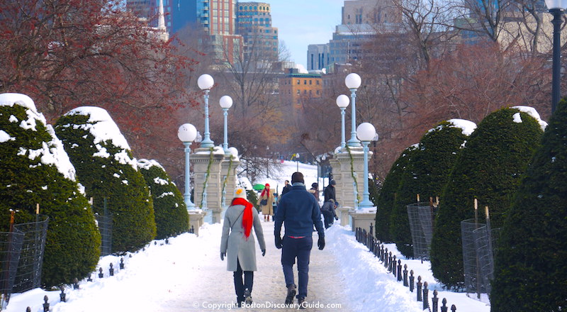 January scene: Walking across the snow-covered footbridge in Boston's Public Garden January scene: Walking across the snow-covered footbridge in Boston's Public Garden