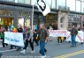 Marchers carrying Peace Action sign in Boston's Veterans Day Parade