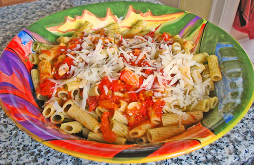 Photo of pasta with homemade marinara sauce and grated cheese
