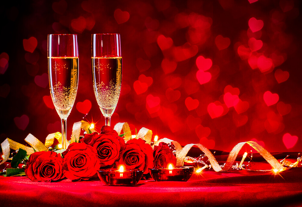 Red roses and champagne for Valentine's Day - Photo credit: Adobe/Alexander Raths
