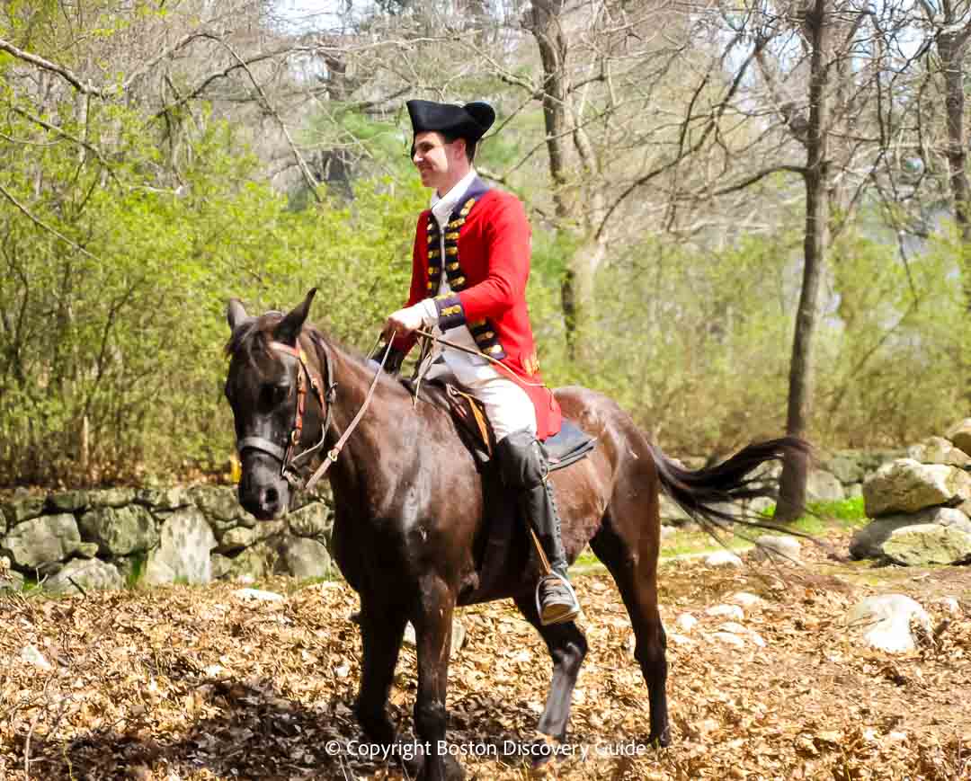 Reenactor portraying British officer on horseback during a battle reenactment near Hanscom Air Force Base in Lincoln Reenactor portraying British officer on horseback during a battle reenactment near Hanscom Air Force Base in Lincoln