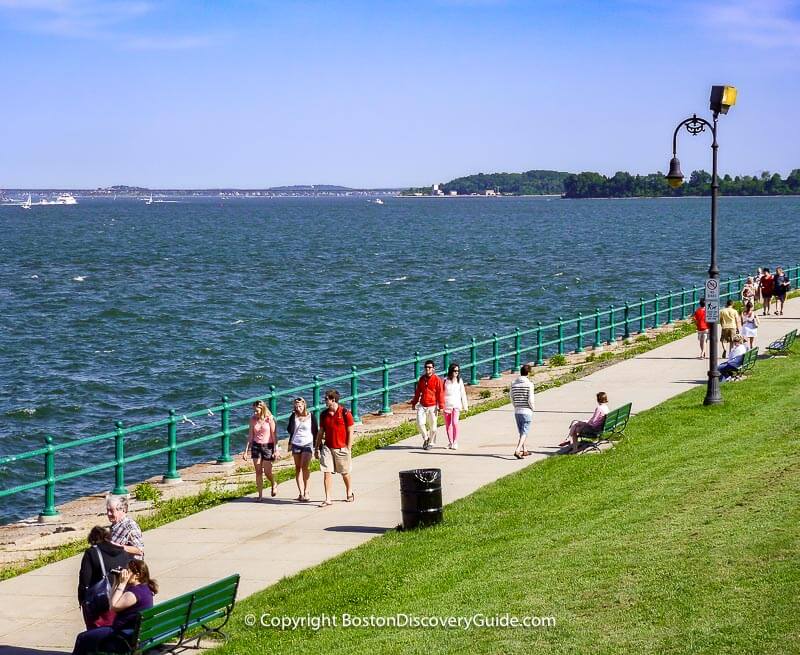 Walking along Harborwalk on Castle Island Walking along Harborwalk on Castle Island