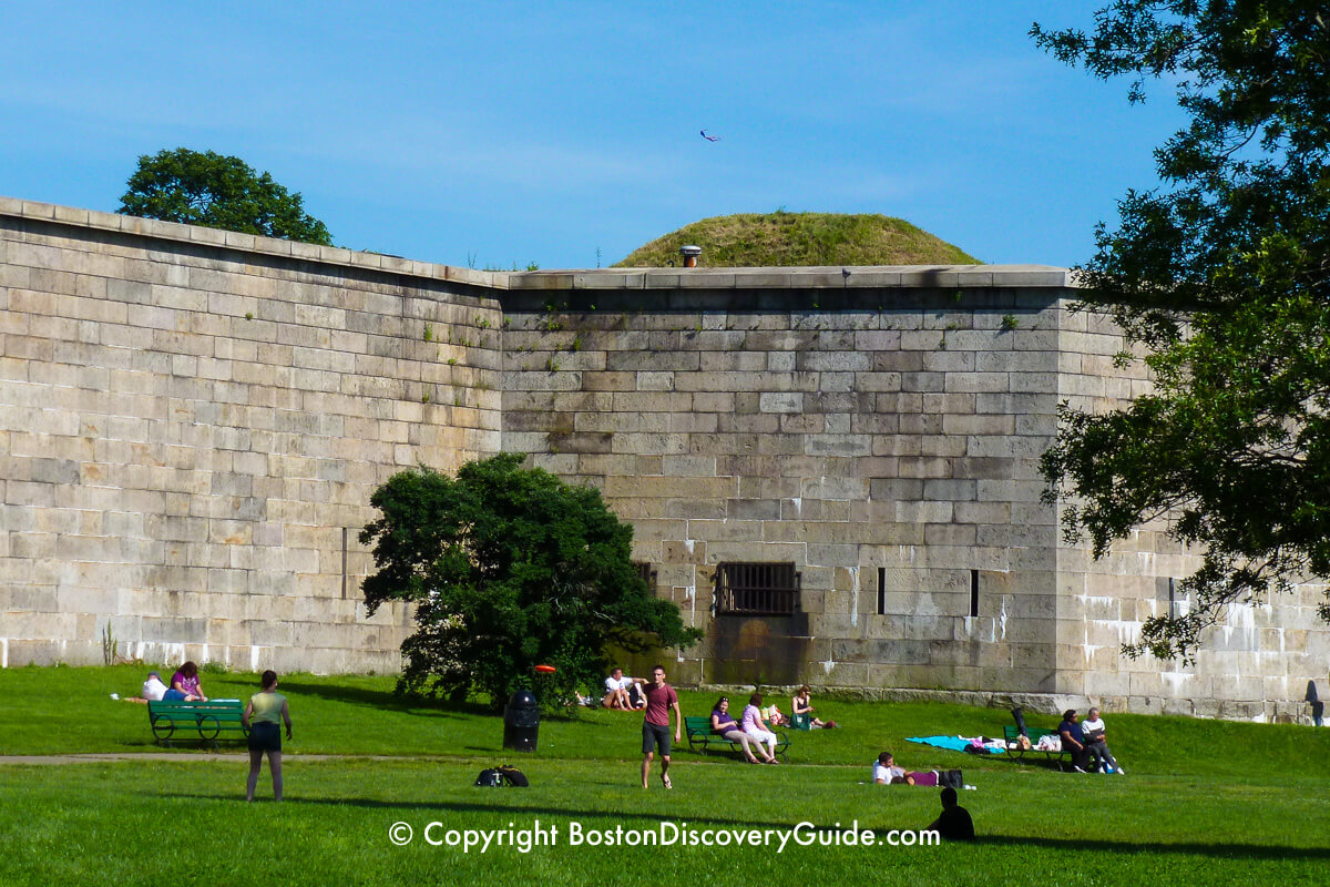 Relaxing on the grassy slopes next to Fort Independence