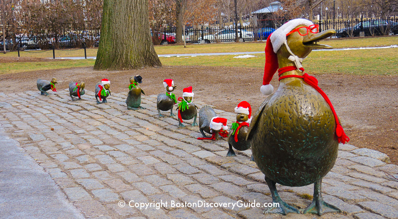 Make Way for Ducklings statues dressed in Santa outfits Make Way for Ducklings statues dressed in Santa outfits