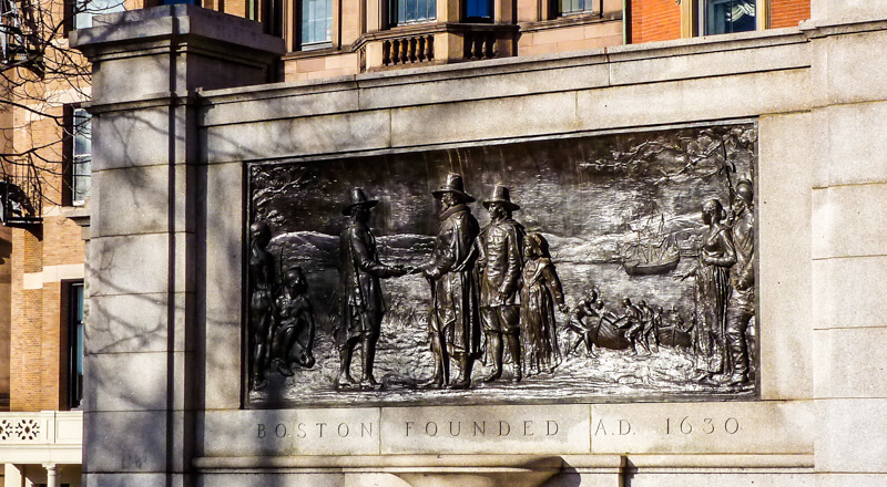 Founders Memorial on Boston Common, with Beacon Hill mansions in the background Founders Memorial on Boston Common, with Beacon Hill mansions in the background