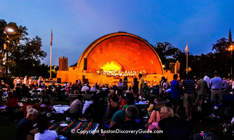 Boston Landmarks Orchestra performing in the Hatch Shell on the Esplanade in August Boston Landmarks Orchestra performing in the Hatch Shell on the Esplanade in August