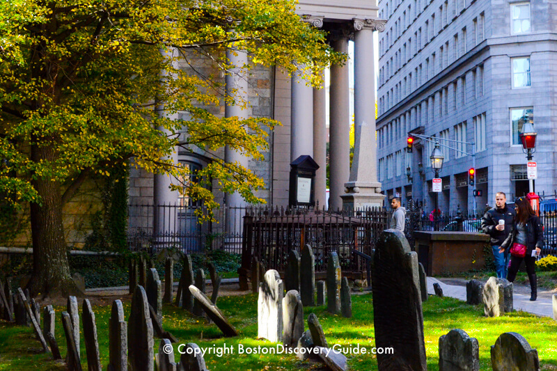 17th King's Chapel Burying Ground, with King's Chapel in the background gravestones in Granary Burying Ground on a fall afternoon King's Chapel Burying Ground, with King's Chapel in the background