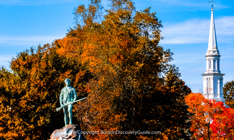 Minuteman statue and church spire near Lexington Green, Revolutionary War battle site