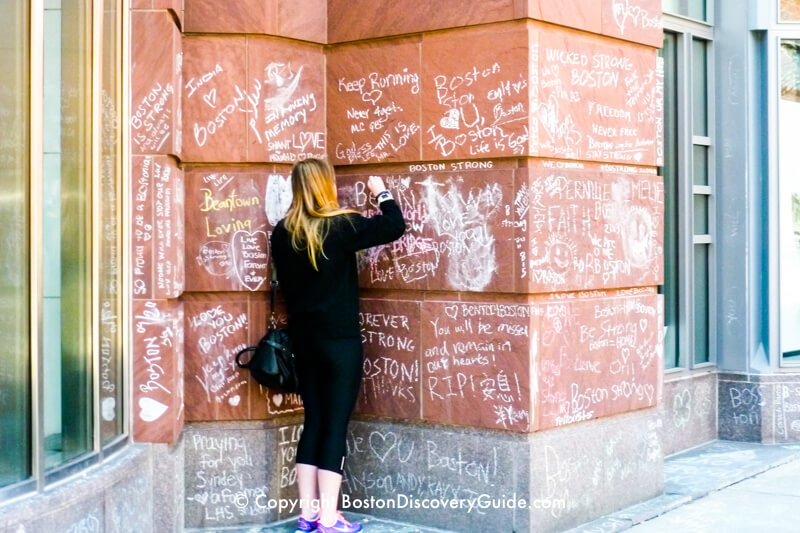 Tributes written on wall outside of Nike store on Newbury Street