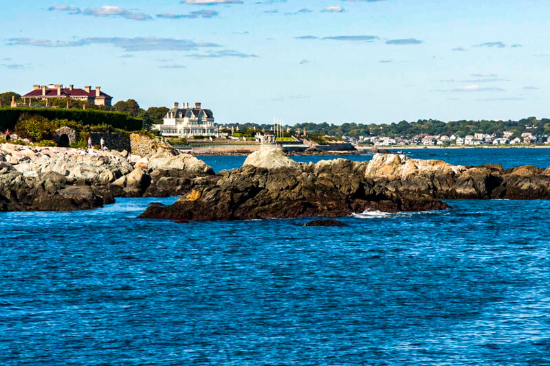 Cliff Walk along the Newport shore, with mansions in the background - Photo credit:  Gary Browning via Creative Commons license