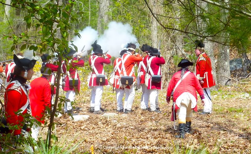 British Reenactors firing their muskets after being ambushed by Colonials during a portrayal of the Redcoats' retreat back to Boston British Reenactors firing their muskets after being ambushed by Colonials during a portrayal of the Redcoats' retreat back to Boston