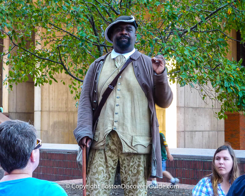 Historic reenactor portraying Boston Massacre victim and revolutionary patriot Crispus Attucks, the first person to die in the American Revolution against the British Historic reenactor portraying Boston Massacre victim and revolutionary patriot Crispus Attucks, the first person to die in the American Revolution against the British
