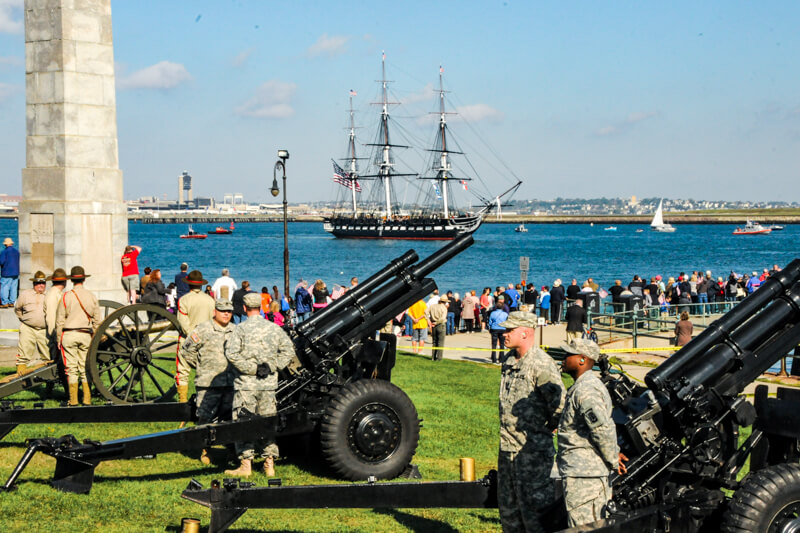 Viewers at Castle Island watching the USS Constitution's turn-around cruise on July 4th