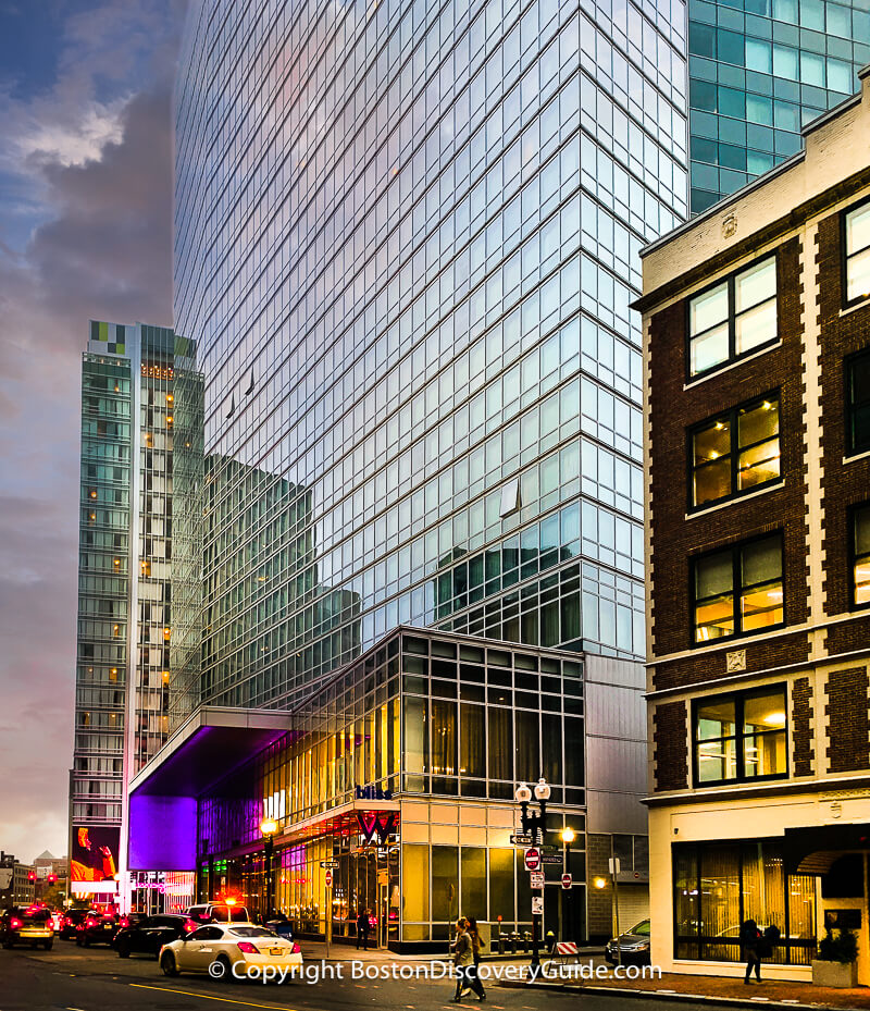 Purple & other colorful lights make the W Boston glow as the sun begins to set