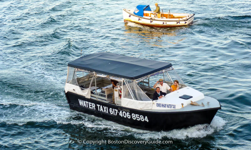 Water taxi going from Boston Logan Airport to Long Wharf on the Downtown Waterfront Water taxi going from Boston Logan Airport to Long Wharf on the Downtown Waterfront