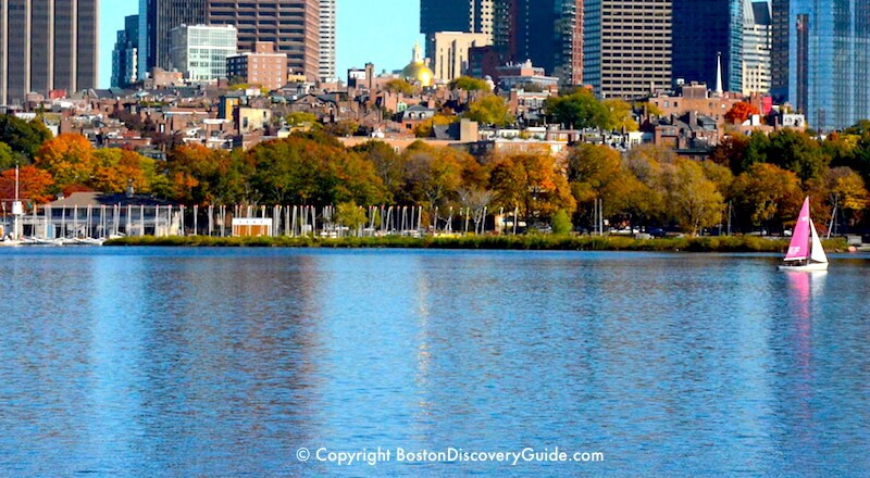 Boston's Beacon Hill neighborhood overlooking the Charles River, with Financial District buildings in the background Boston's Beacon Hill neighborhood overlooking the Charles River, with Financial District buildings in the background