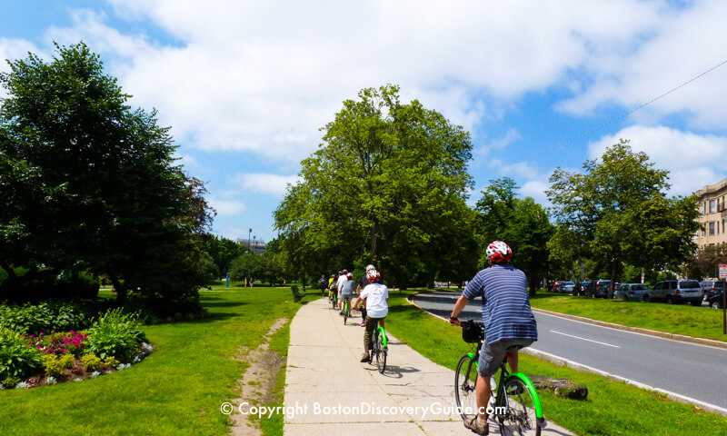 Bike riders in Boston's Fenway neighborhood, near the famous Victory Gardens