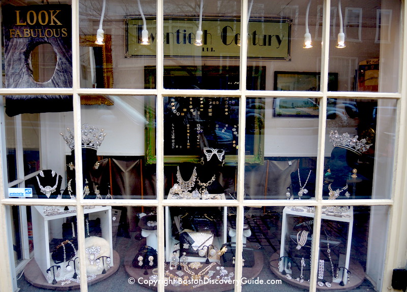 Deco, vintage, designer, costume, and fanciful jewelry in shop window on Charles Street