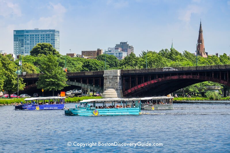 Three duck boats passing under the Longfellow Bridge