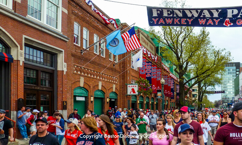 Red Sox fans walking to Fenway Park for a game Red Sox fans walking to Fenway Park for a game