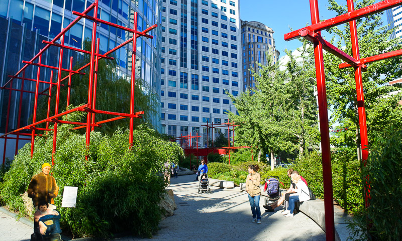 Winding pathway bordered by bamboo, treese, and peonies in the Chinatown Park