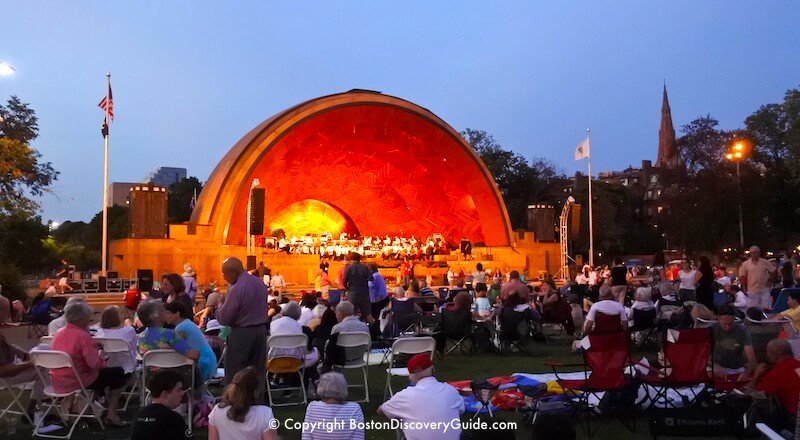 Concert at the Hatch Shell on Boston's Esplanade by the Charles River, on a balmy night in August  