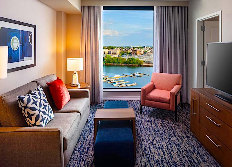 Guest room with a water view at Homewood Suites Boston Seaport