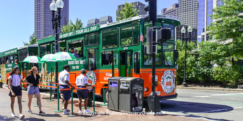 Hop on hop off trolley picking up passengers near Faneuil Marketplace