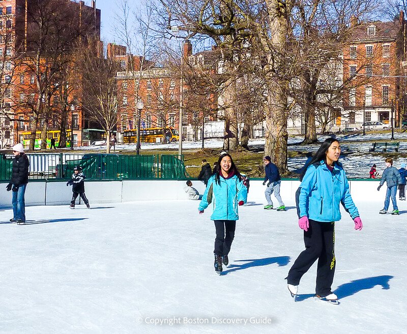 Frog Pond ice rink on Boston Common, with beautiful Beacon Hill mansions in the background