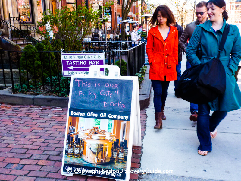 Sign with David Ortiz quote in front of a shop on Newbury Street