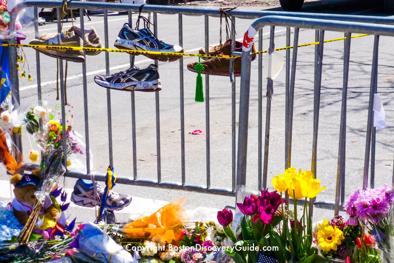 Running shoes on barricade blocking off Exeter Street Running shoes on barricade blocking off Exeter Street