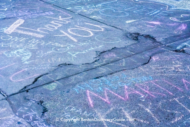 Tributes written in chalk on the sidewalk along Newbury Street Tributes written in chalk on the sidewalk along Newbury Street