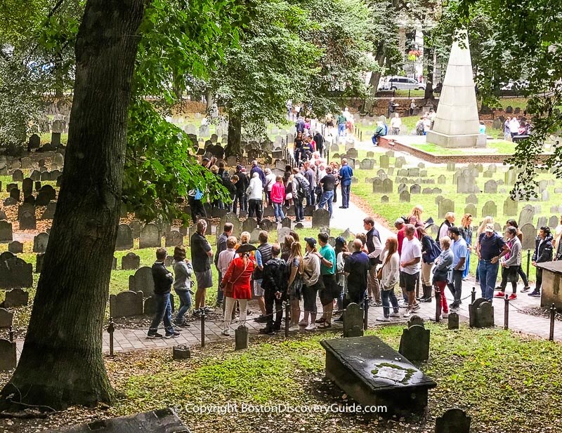 Tour group with costumed guide (in red) at Granary Burying Ground 