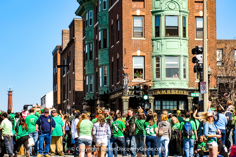 Crowds watching the St Patrick's Day Parade on West Broadway