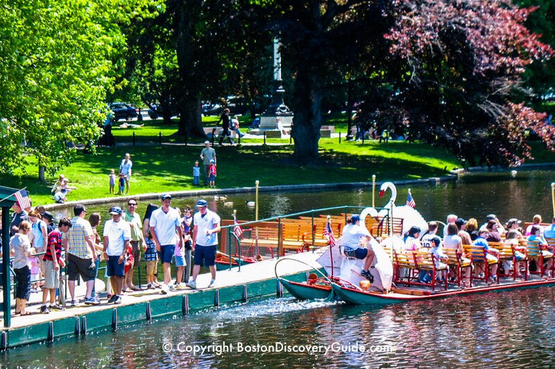 This swan boat is pushing off from the boarding ramp