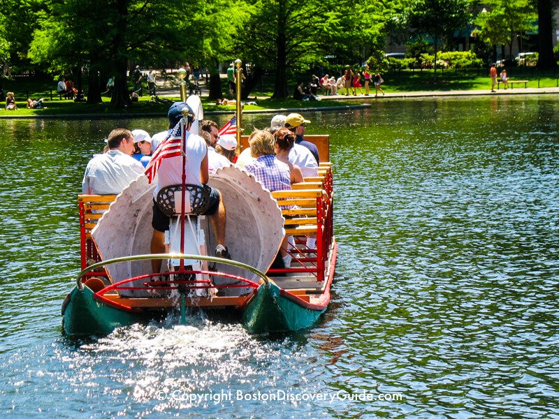 Look closely, and you can see the swan boat crew member pumping the pedals as he steers the boat around a curve