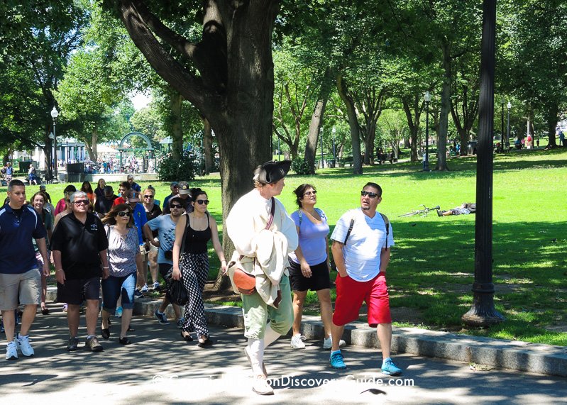 Tour guide leading tour group along Freedom Trail on Boston Common