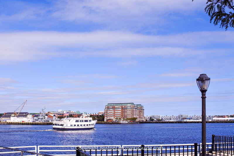 Cruise boat seen from Harborwalk on Boston's Downtown Waterfront