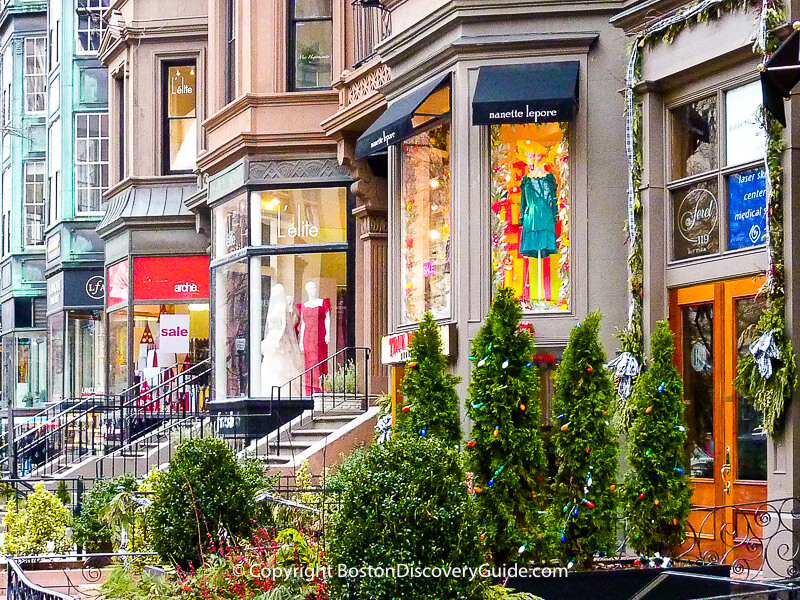 Sale signs and holiday decorations along Back Bay's Newbury Street