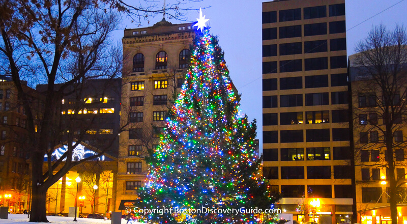 Christmas in Boston - Blink! holiday lights and Christmas tree in Faneuil Hall Marketplace - Custom House in background - BostonDiscoveryGuide.com Christmas tree on Boston Common - gift from Nova Scotia